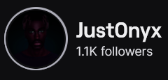JustOnyx's Twitch logo and follower count (1.1k). Logo is a black background with the face of a black man, faintly in the center. Image links to JustOnyx's Twitch page.