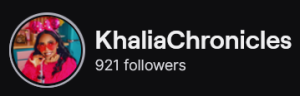 KhaliaChronicles' Twitch logo and follower count (921). Logo is a picture of a black woman with long curly black hair, wearing red sunglasses and a dark pink sweater.
Image links to KhaliaChronicles' Twitch page.
